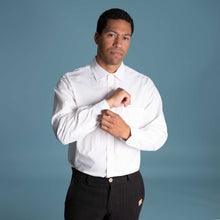 Load image into Gallery viewer, Man wearing a white 100% organic cotton dress shirt and black pants